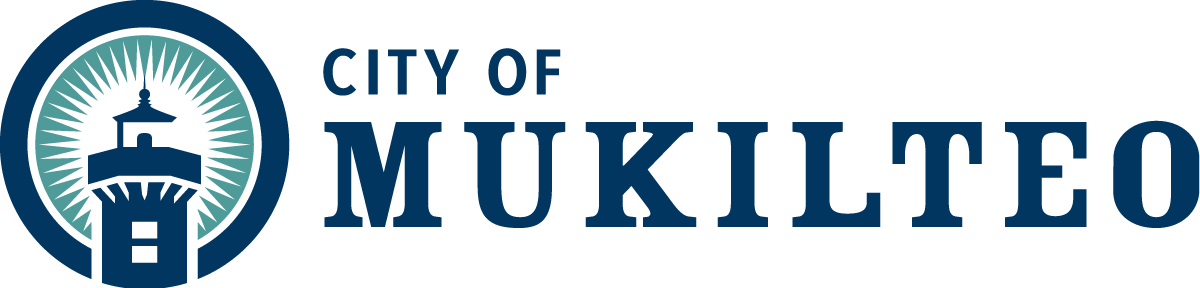 Logo of the City of Mukilteo, blue lettering and lighthouse with green ray of light shining out